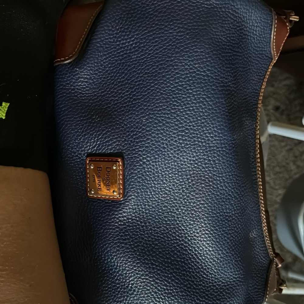 Authentic Navy Blue Dooney and Burke purse. Used 4 times .